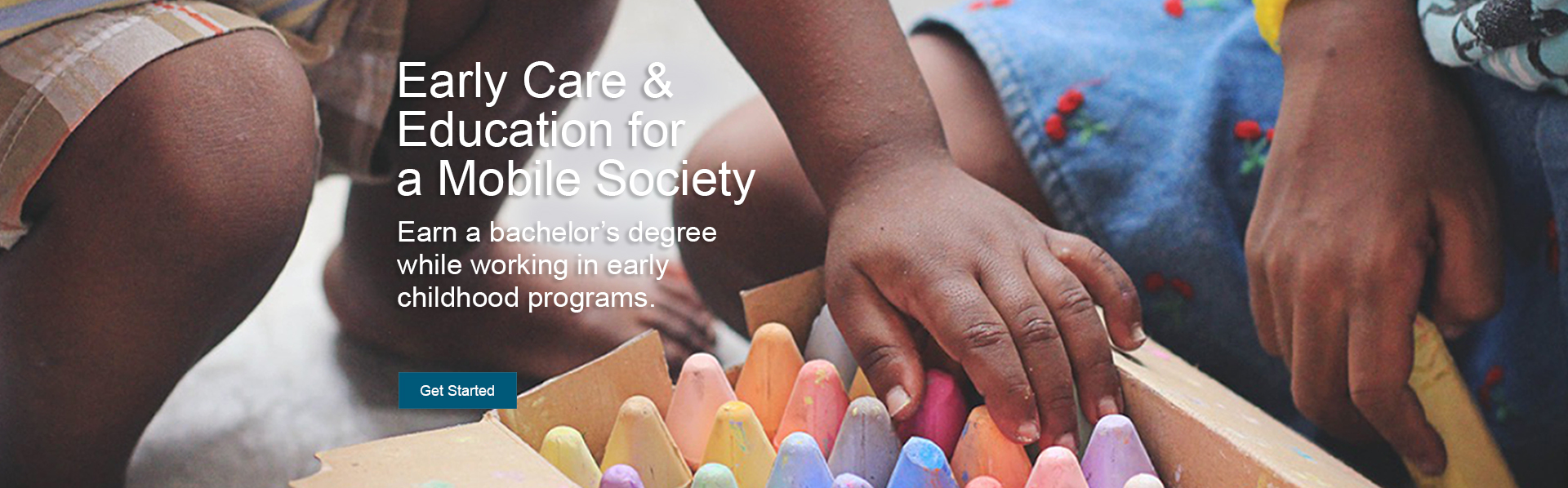 Children’s hands reach into a box of various colored chalk. The online early care and education bachelor's degree completion program prepares educators to work in early childhood settings, especially those whose family members are highly mobile.